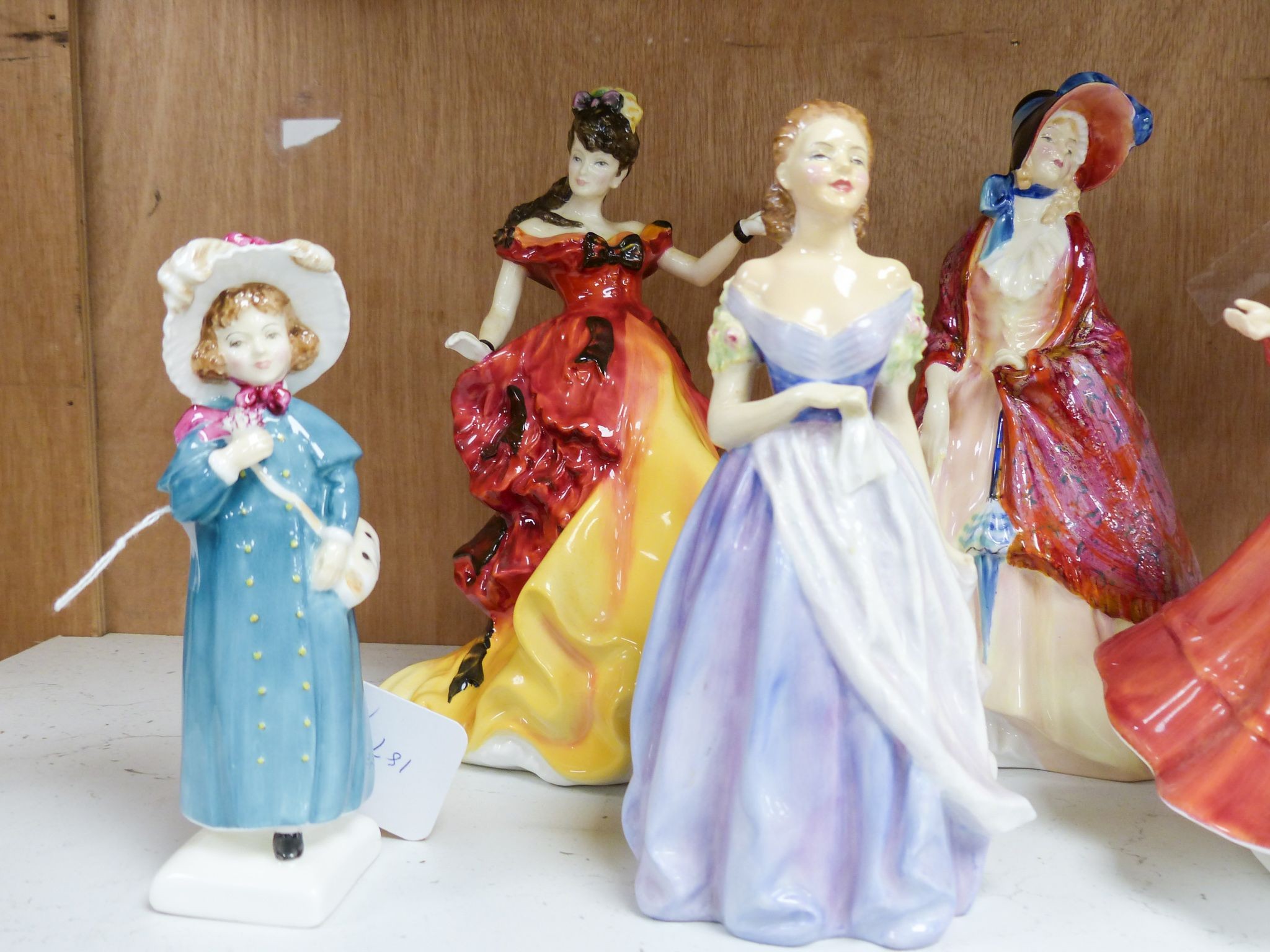 Seven Royal Doulton figurines: Carrie HN2800, Jacqueline HN2000, For You HN3754, Diana Princess of Wales HN5061, Belle HN3703, Patricia HN3365, Paisley Shawl HN1987